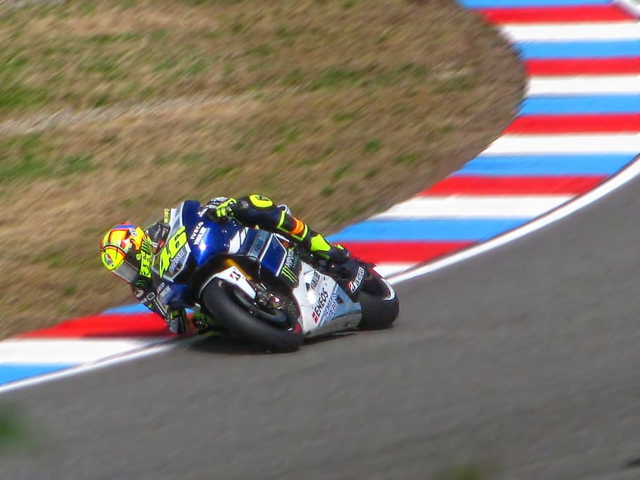 person riding sports bike on track during daytime, Valentino Rossi