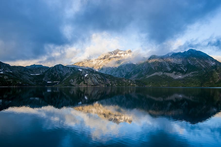 parorama photography of mountain under cloudy sky, snow capped mountain near body of water under blue cloudy sky HD wallpaper