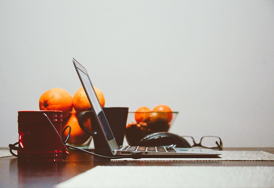photo of laptop computer beside bowl of orange fruits, macbook, HD wallpaper
