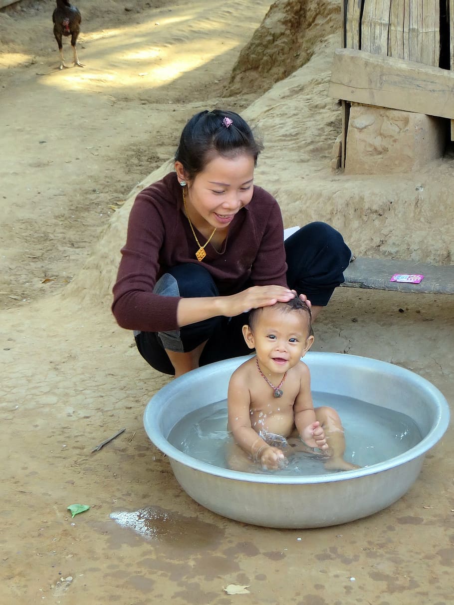 rural little girl bathing Depositphotos