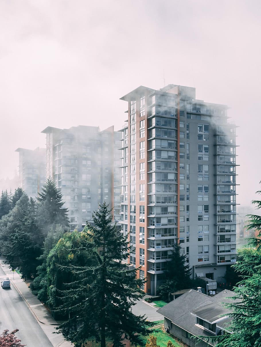 gray and brown building in foggy weather during daytime, high-angle photography of high rise building HD wallpaper