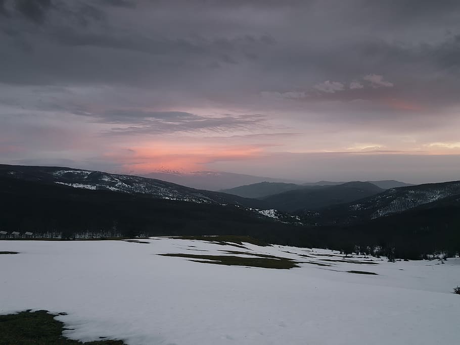 mountains under gray sky at golden hour, snow covered mountain during daytime photo HD wallpaper