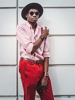 man in fedora hat, pink pinstripe dress shirt, and red denim bottoms outfit HD wallpaper