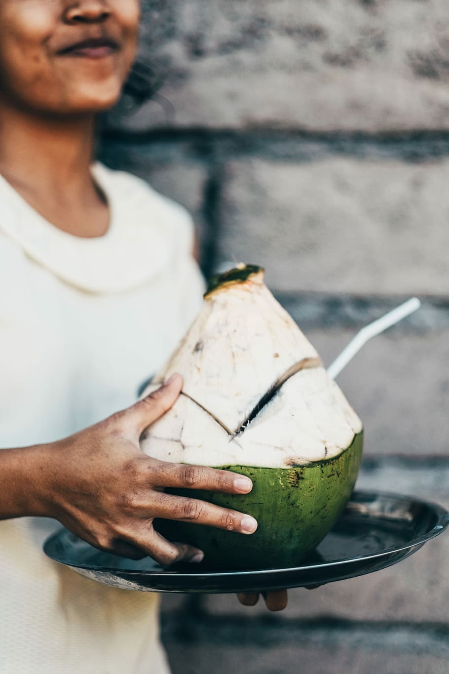person holding coconut shell, smiling woman carrying and holding coconut juice HD wallpaper