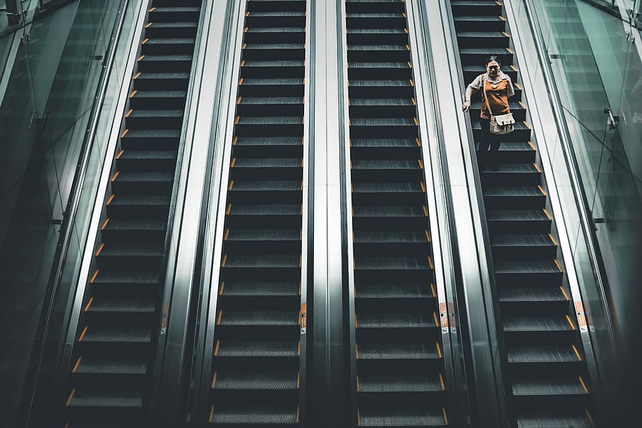 woman standing on the escalator, woman standing in elevator, steps HD wallpaper