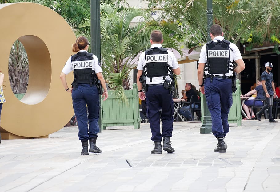three police officers walking outdoor, policeman, uniform, text, HD wallpaper