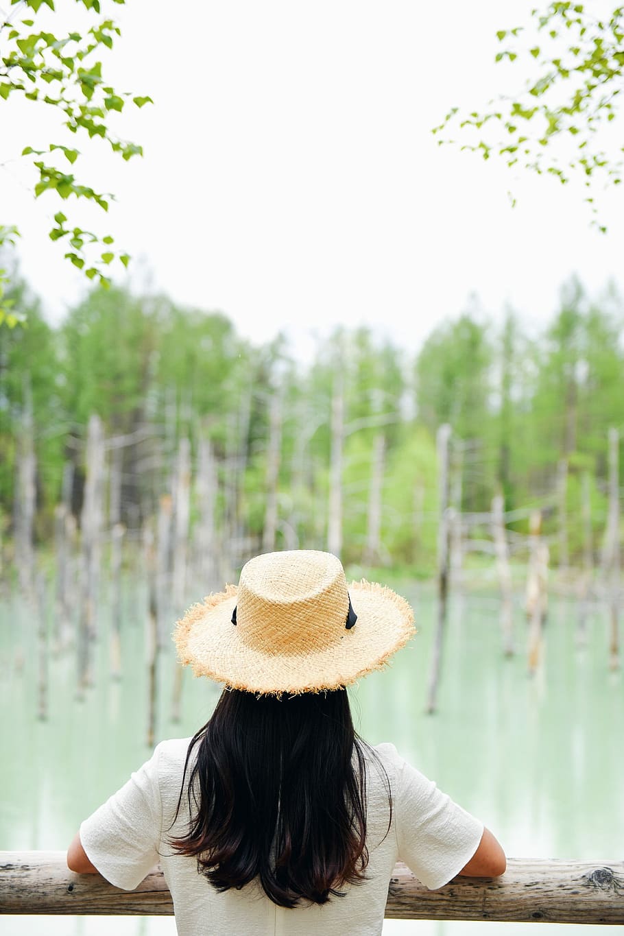 person in white shirt in brown wooden rail during daytime, vacation HD wallpaper