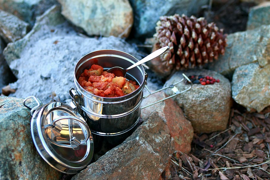 stainless steel tiffin box on rocks near brown pine cone during daytime, HD wallpaper