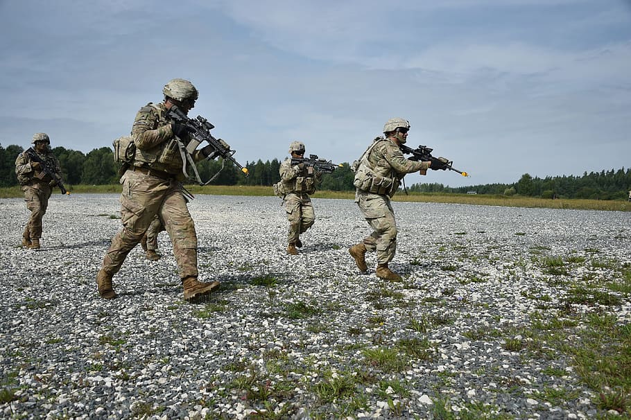 soldiers holding rifles walking on grass, army, helicopter, training