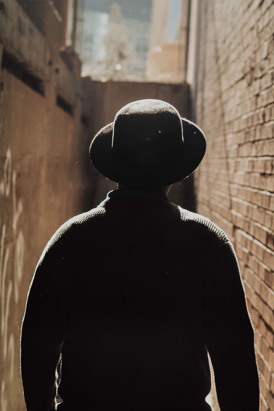 person in black sun hat, man wearing brown hat walking in pathway HD wallpaper