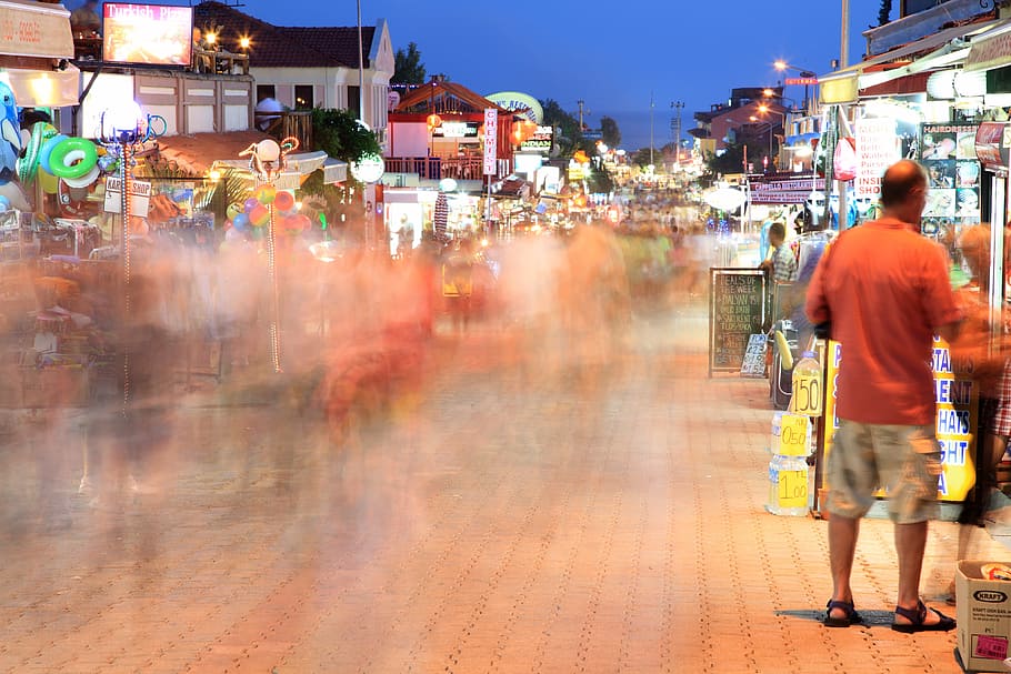 people standing at the part during nighttime, blurred, busy HD wallpaper