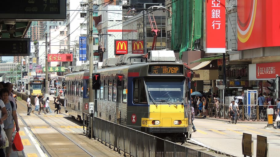 yellow and grey tram beside structures, hongkong, railway, asia