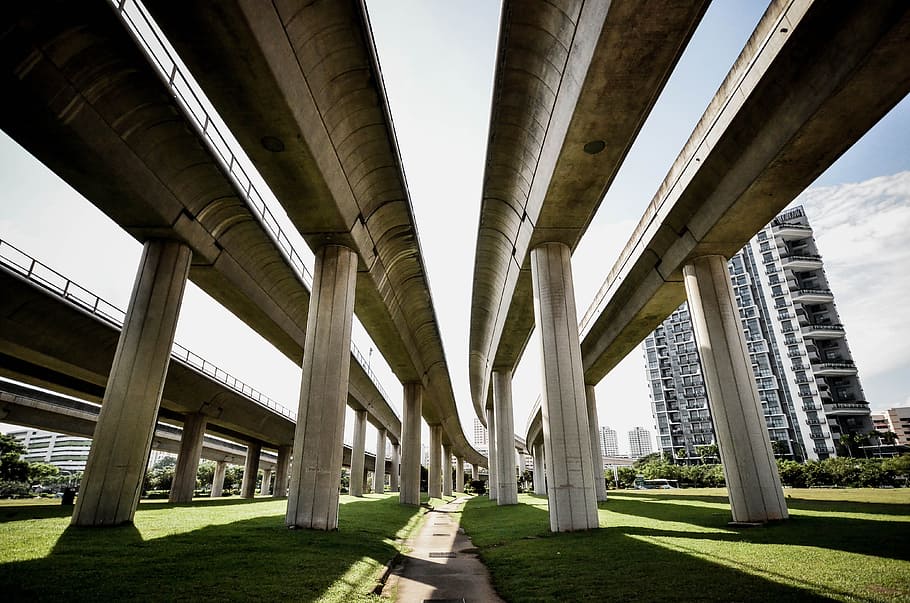 gray concrete train rail on green grass field near building, photo of bridge HD wallpaper