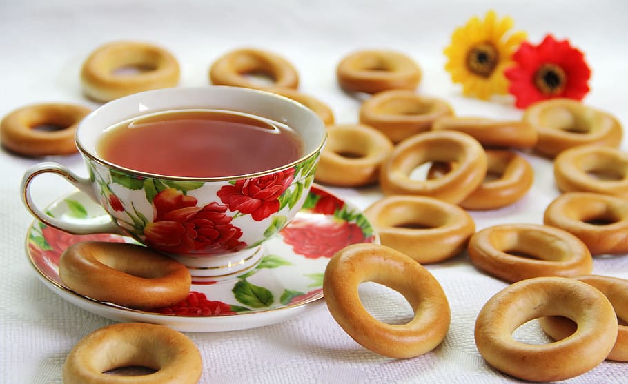 brown donuts on white textile, bagel, dry, tea, cup, breakfast HD wallpaper