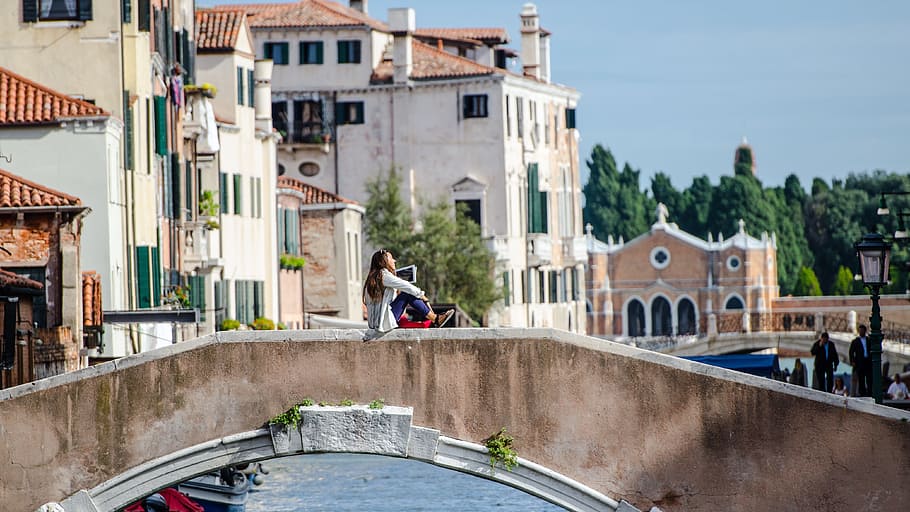 woman sitting on bridge rail over canal, woman, sitting, italy, house, HD wallpaper