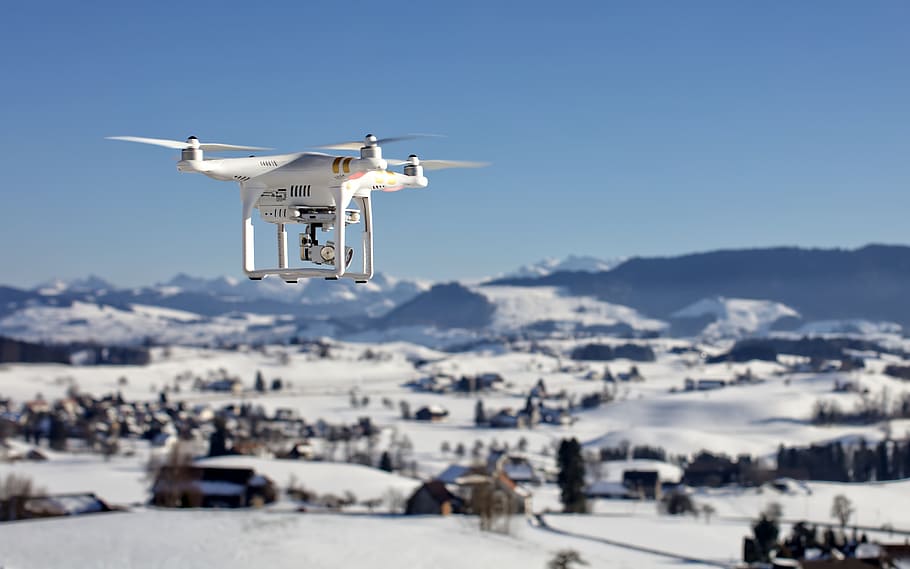 white DJI drone floating over houses during daytime, camera HD wallpaper