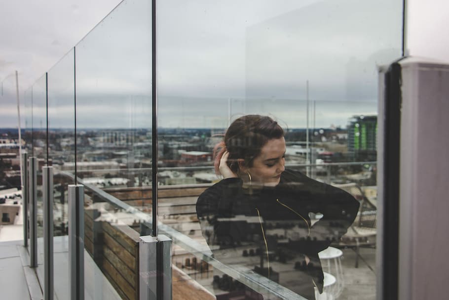 woman holding her hair, woman leaning on glass wall, reflection HD wallpaper