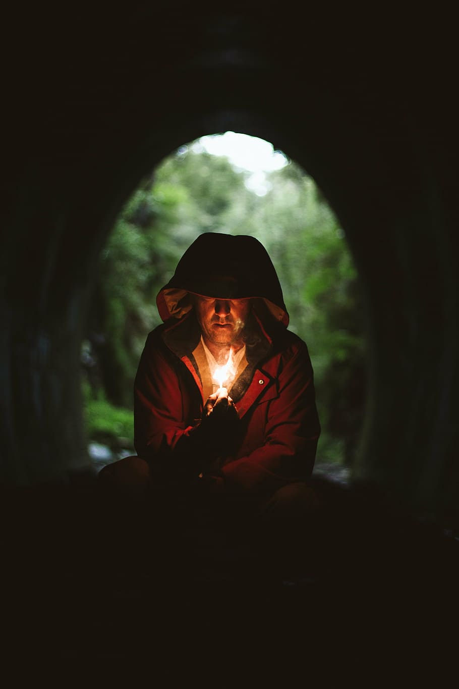 selective focus photography of man wearing brown coat holding matchstick HD wallpaper