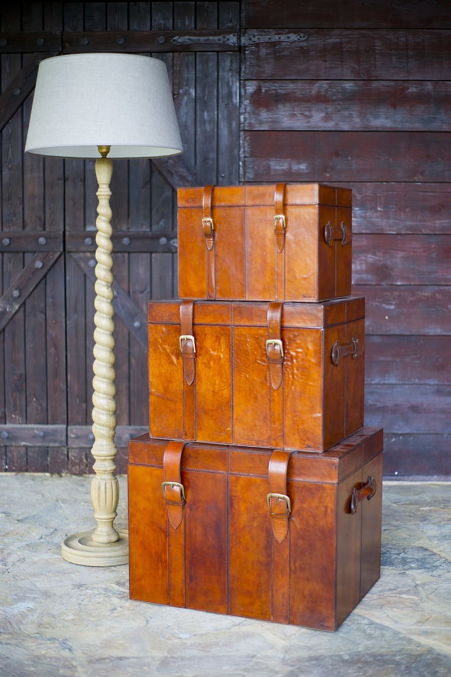 three brown wooden hope chests beside white floor lamp, Luggage