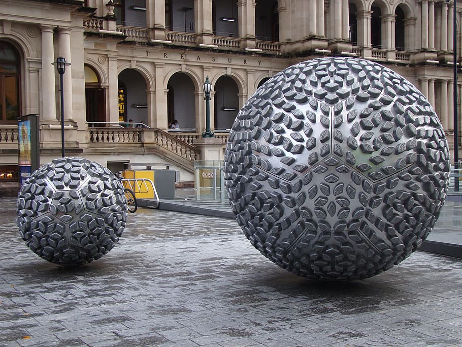 close-up photography of two gray ball statue at daytime, australia HD wallpaper