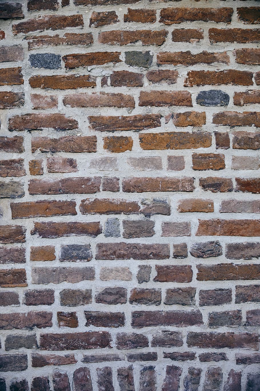 A Brick Wall with a Character, closeup photo of brown brick wall HD wallpaper