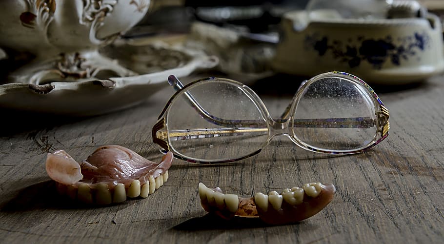 eyeglasses near dentures, eyeglasses with white frames, scary