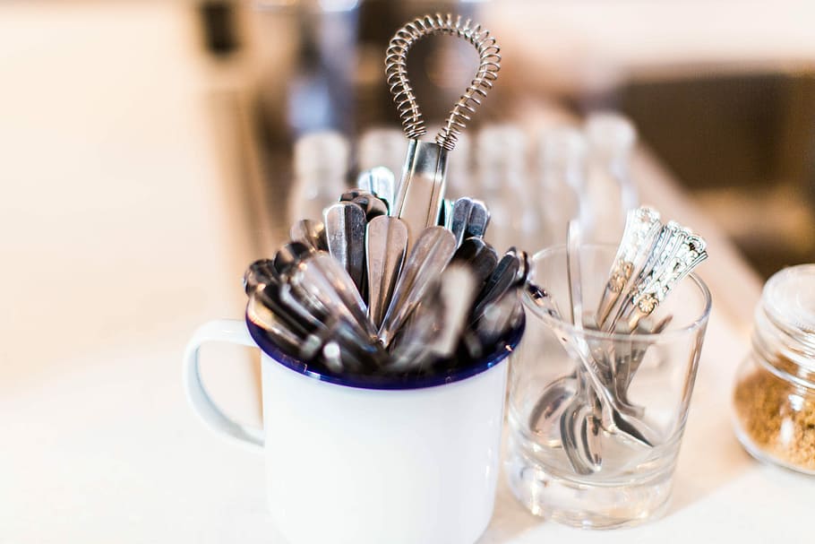 selective focused photo of a stainless steel accessorty, white ceramic mug on table HD wallpaper