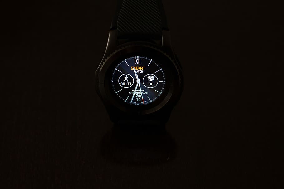 round black smartwatch, turned-on round black chronograph watch