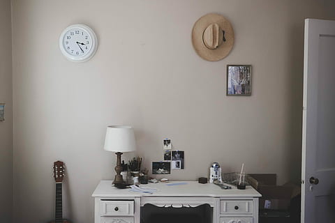 table lamp on knee-hole desk beside closed door, table lamp and R2-D2 figure on white desk HD wallpaper
