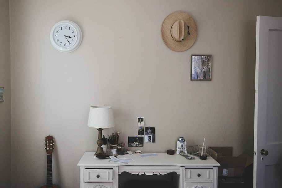 table lamp on knee-hole desk beside closed door, table lamp and R2-D2 figure on white desk HD wallpaper