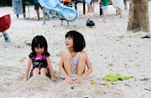2 Girls Sitting on Seashore, beach, children, cute, fun, happy HD wallpaper