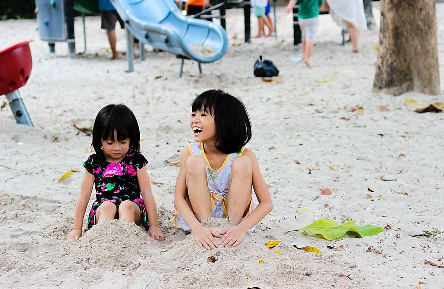 2 Girls Sitting on Seashore, beach, children, cute, fun, happy HD wallpaper