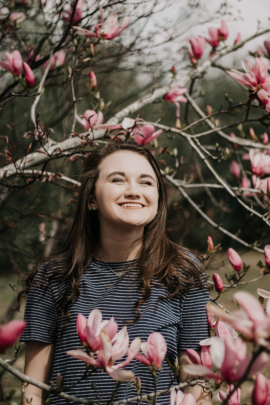 woman standing near pink flowering tree, smile, person, outdoor HD wallpaper