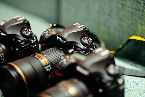 black Nikon DSLR camera, closeup photography of black Nikon DSLR cameras HD wallpaper