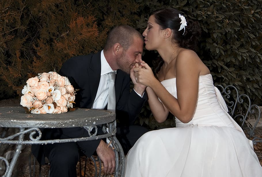 woman wearing white wedding dress while men kissing her hands wearing black suit jacket photograph, HD wallpaper