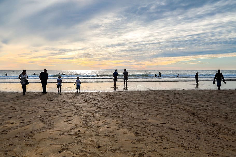sunset, beach, low tide, people, recreation, england, sea, water HD wallpaper