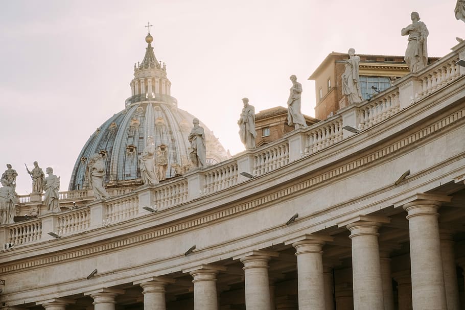 St. Peters Basilica, Italy, white concrete buildings with statues on balcony