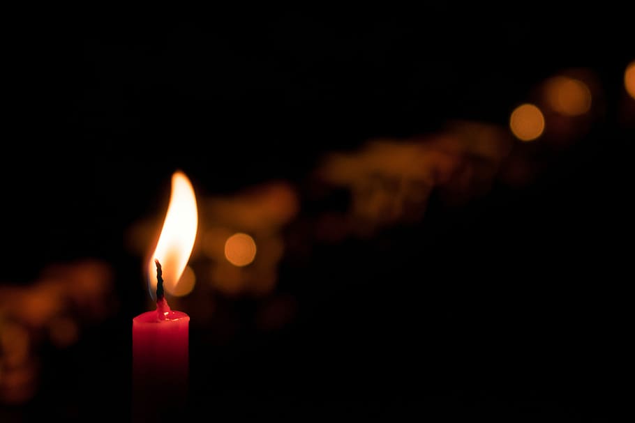 selective focus photography of red candle, shallow focus photo of lighted candle HD wallpaper