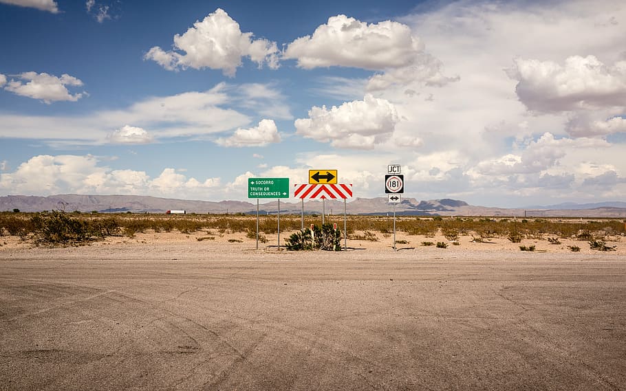 three assorted-color road signage, clouds, mountain, signs HD wallpaper
