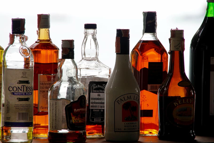 assorted-brand liquor bottle lot, alcohol, bottles, counter, bar