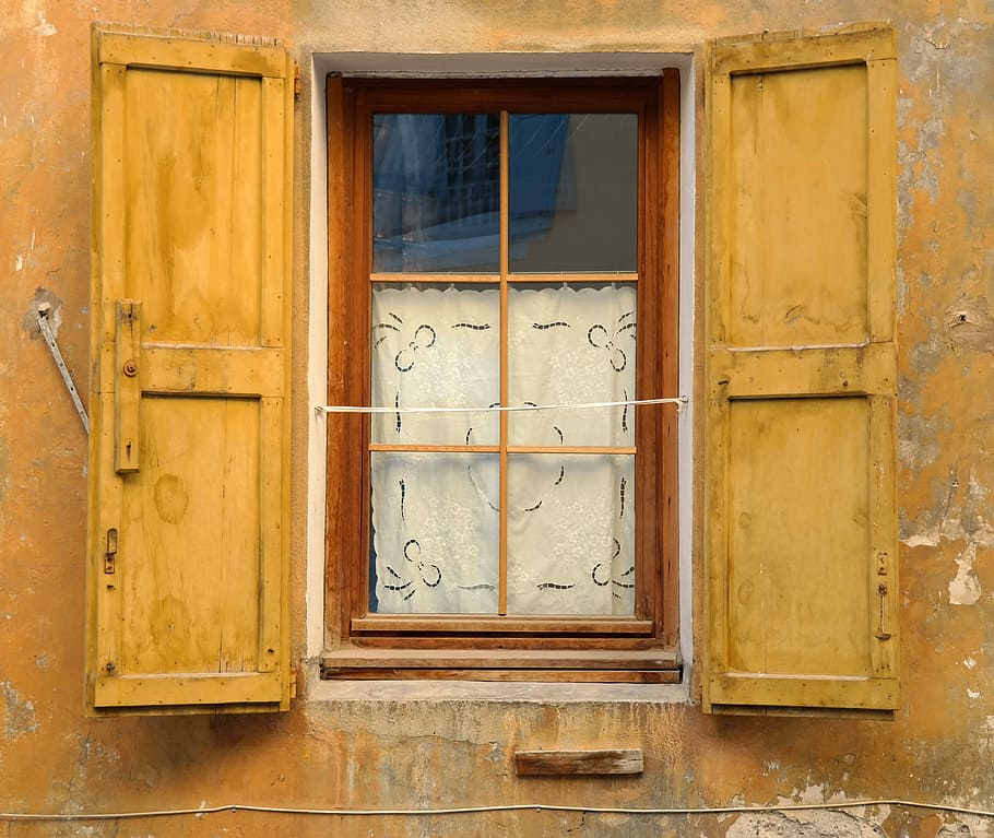 photo of brown wooden window open, brown concrete building with yellow metal window at daytime HD wallpaper