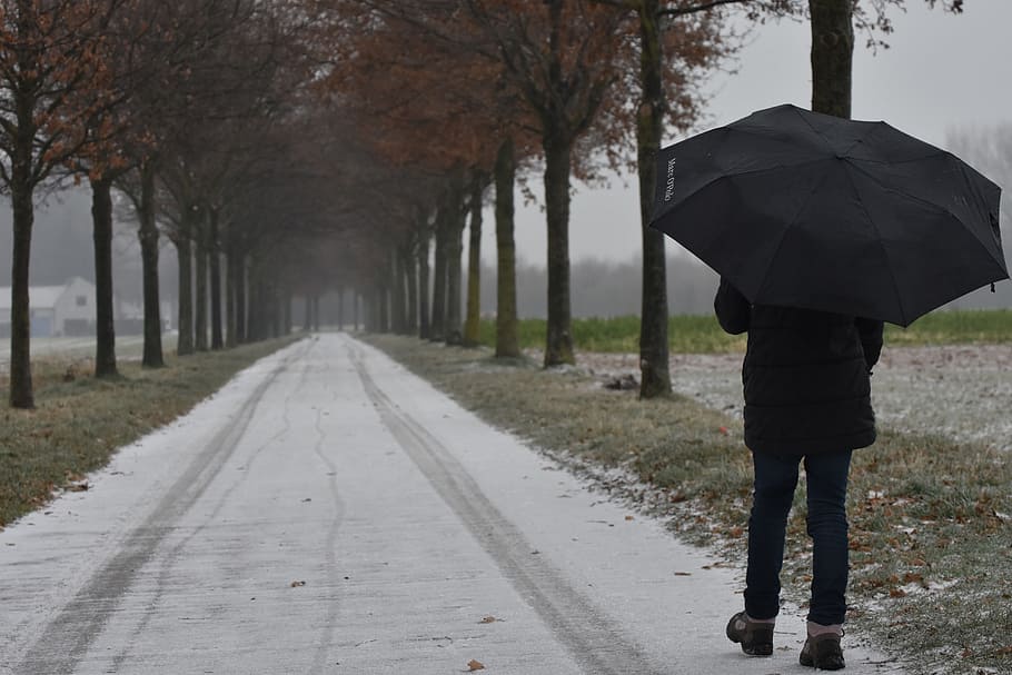 person holding black umbrella while walking on road, Hiking HD wallpaper
