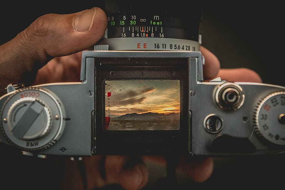 shallow focus photography of camera, person, holding, gray HD wallpaper