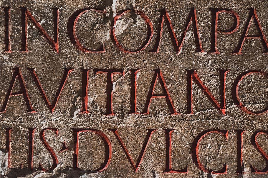 Incompa Avitanc text on brown surface, words etched on wall, red letter, HD wallpaper