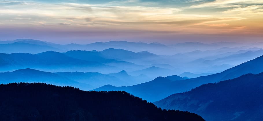 silhouette of mountains covered by fogs at the horizon, silhouette of hills during golden hour HD wallpaper