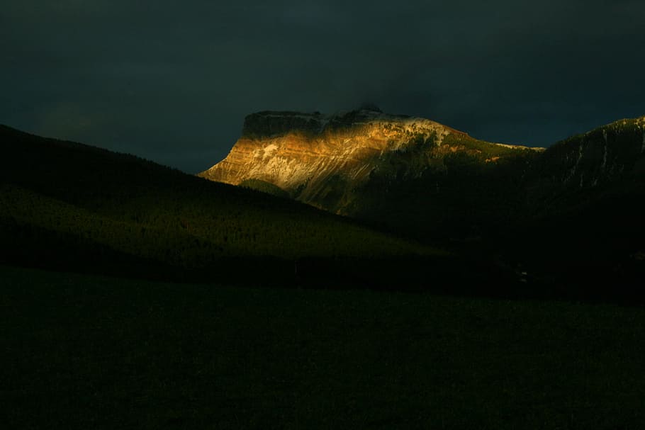 brown rock formations under nimbus clouds, landscape photography of brown mountain HD wallpaper