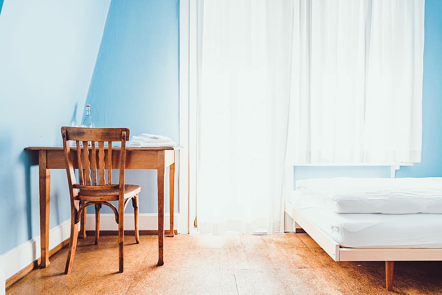 brown wooden chair near mattress, brown wooden desk and chair near white mattress bed inside room HD wallpaper