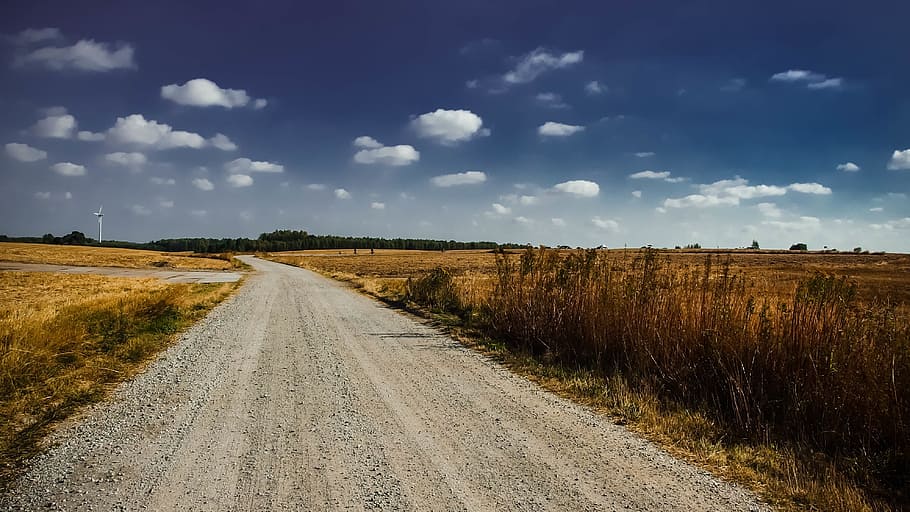 grey rough road in between green grasses, clouds, countryside HD wallpaper