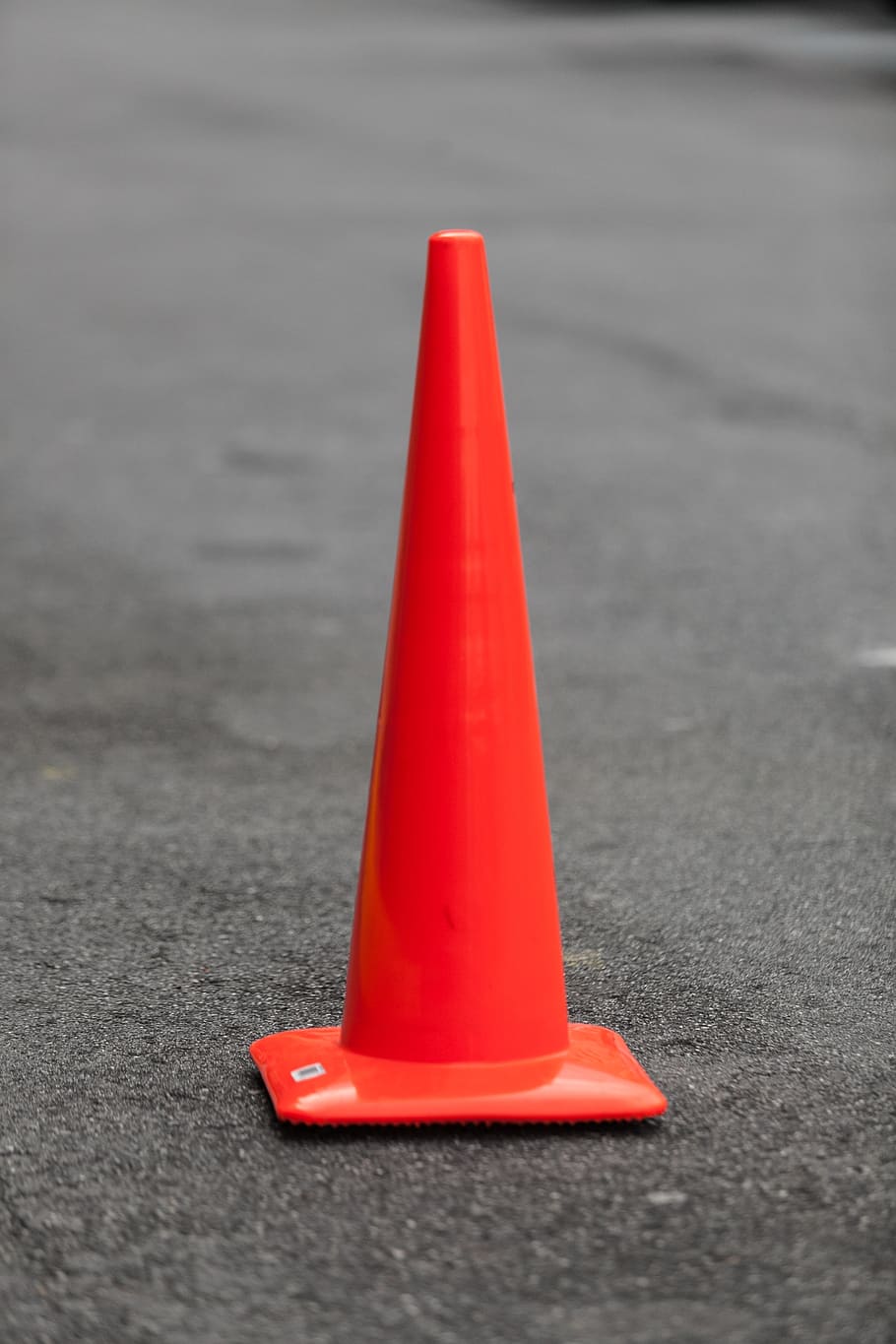 orange traffic cone on black asphalt, road, construction, danger