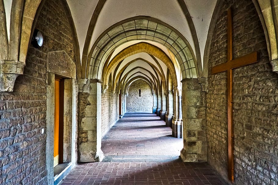 interior photo of brown stone building, church, cloister, architecture